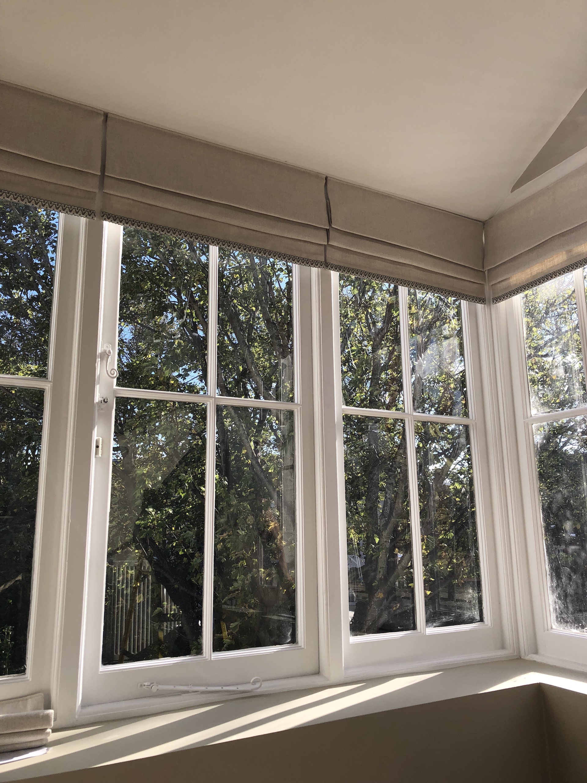 Custom installed blinds on sash windows. Work by Fiona Lawson Design.
